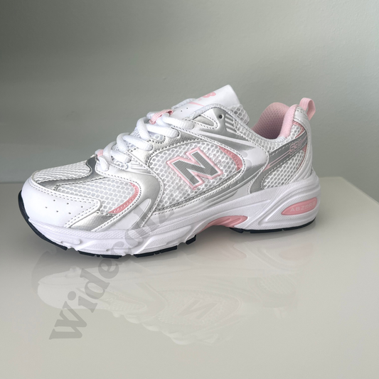 Zapatillas premium modelo 530 blanca con detalles rosa